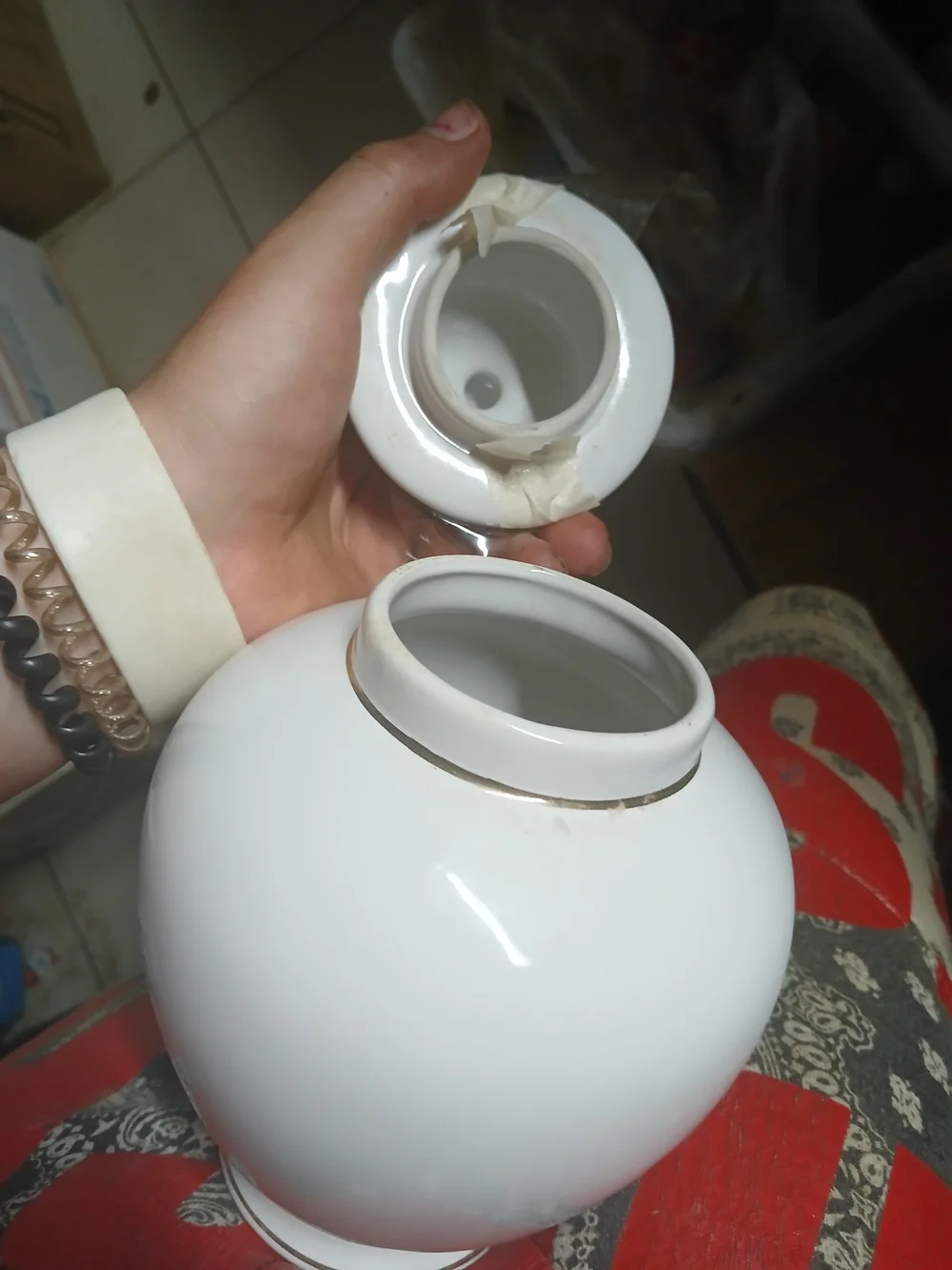 vintage Japanese white porcelain ginger jar featuring a metallic inlaid medallio